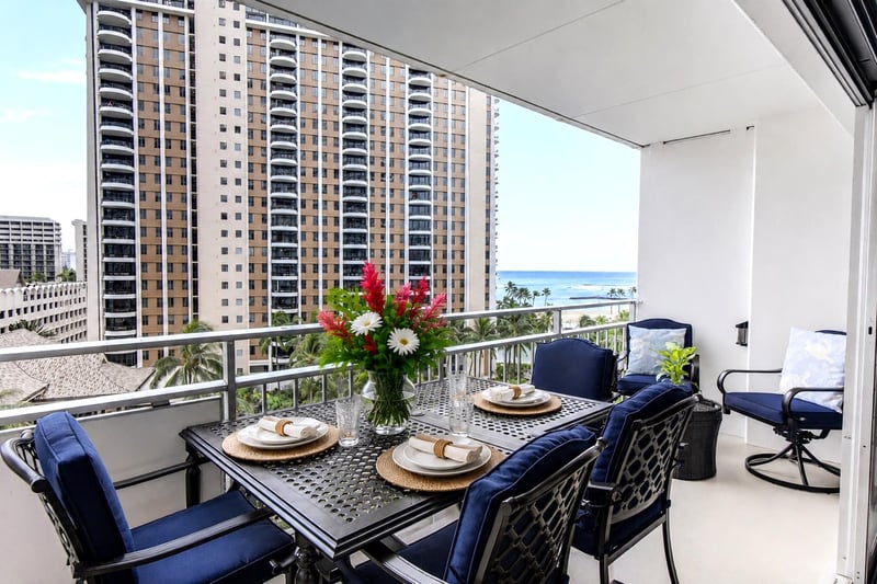Relax on your private lanai at Ilikai Resort & Spa with outdoor dining, tropical breezes, and views toward the Pacific