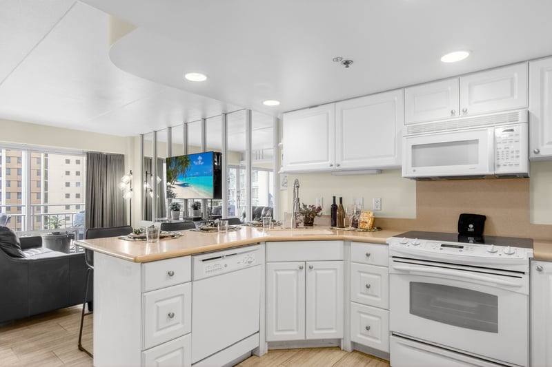 Fully equipped kitchen with modern appliances, ample counter space, and custom cabinetry. ILK-732
