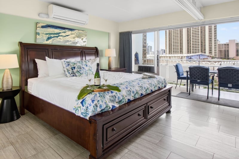 Spacious primary bedroom with warm tropical accents and a relaxing resort atmosphere. ILK-732