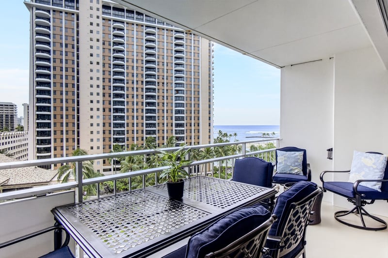 The spacious lanai features a comfortable dining area complete with seating for four, with two additional chairs.