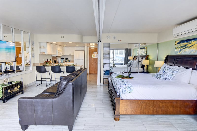 Bedroom area featuring a plush king-size bed and large windows for a bright feel. ILK-732