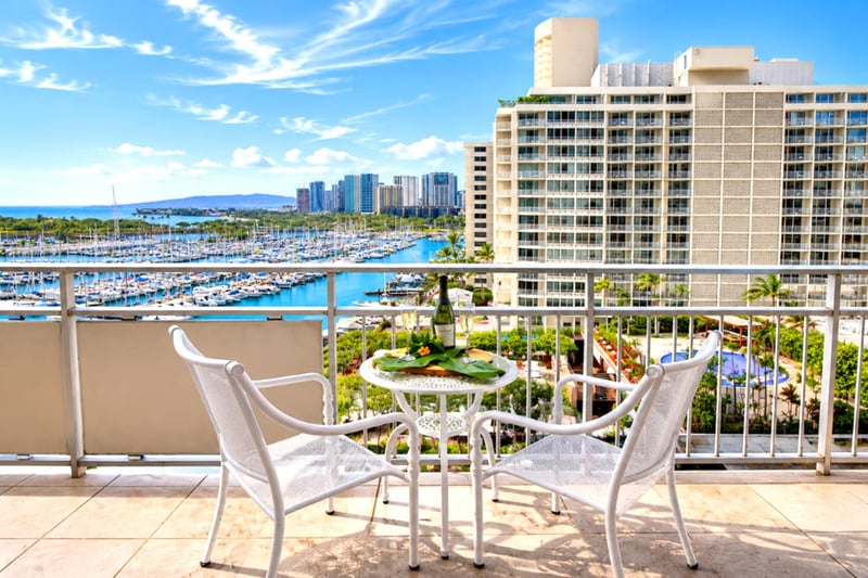 Blue-sky mornings on the lanai with sweeping views over the Ala Wai marina, lagoon pools, and the Waikiki skyline - made for couples.