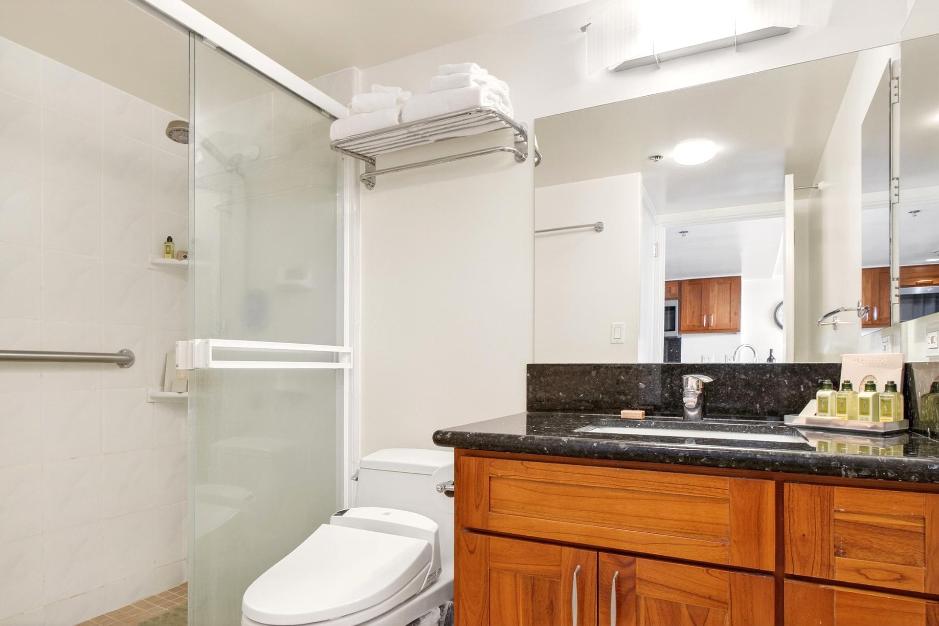 The walk in shower and spacious vanity is the perfect place to unwind or get ready for your day