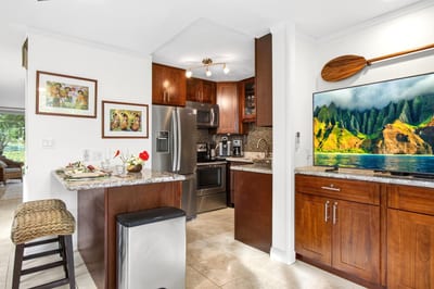 Cook with ease in the fully equipped kitchen overlooking the dining area