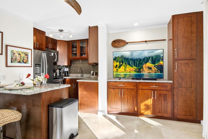 Bright kitchen featuring warm wood cabinetry and island style finishes