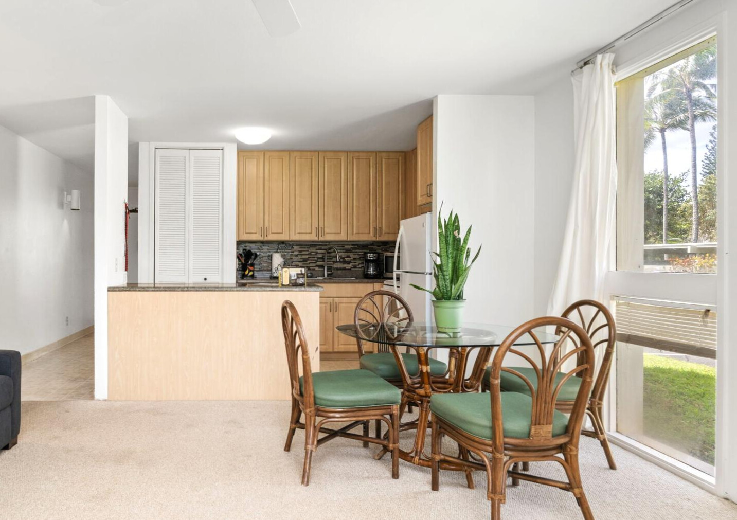 Where rattan chairs gather like old friends, morning light spills in like honey, and the view says “linger a little longer