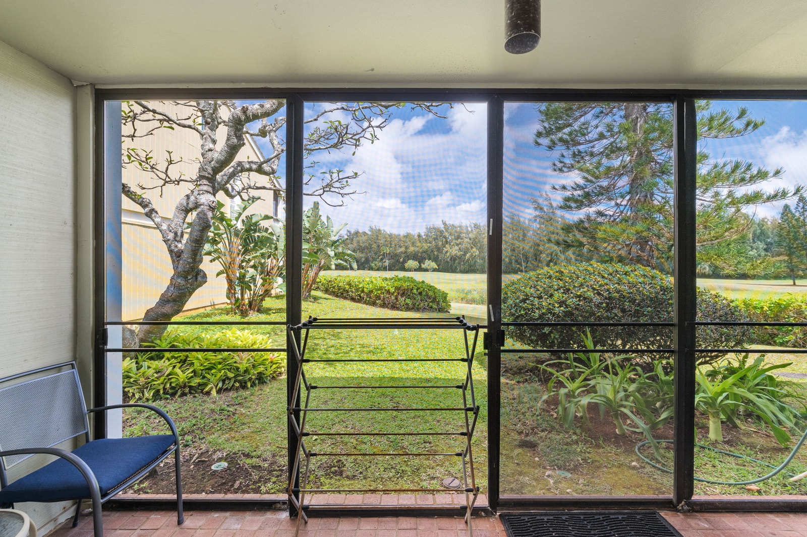 Surrounded by blooms and birdsong, this garden-side nook is made for meditative mornings and mellow evenings    