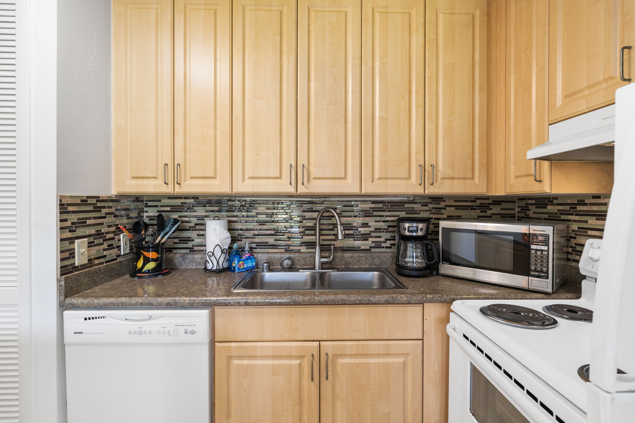  Wrapped in golden maple and soft morning light, this kitchen invites you to slow-cook, sip, and savor every island moment   