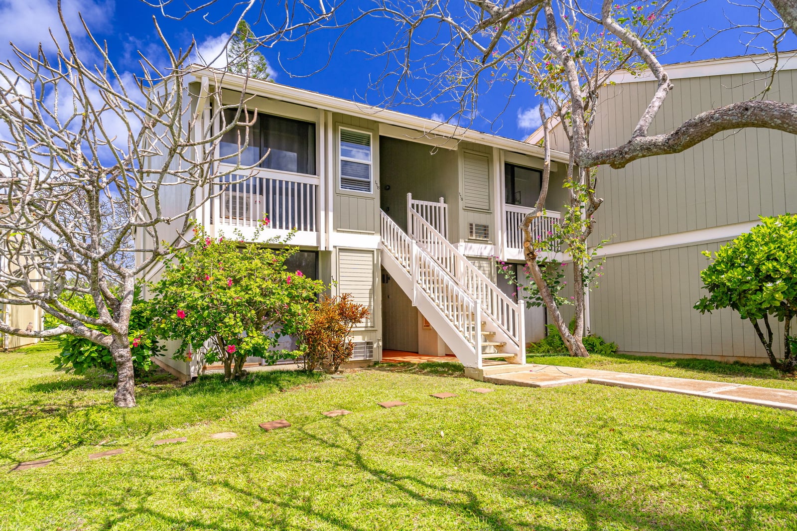 Whether you're arriving barefoot or suitcase-laden, this cheerful facade says the best is yet to come    