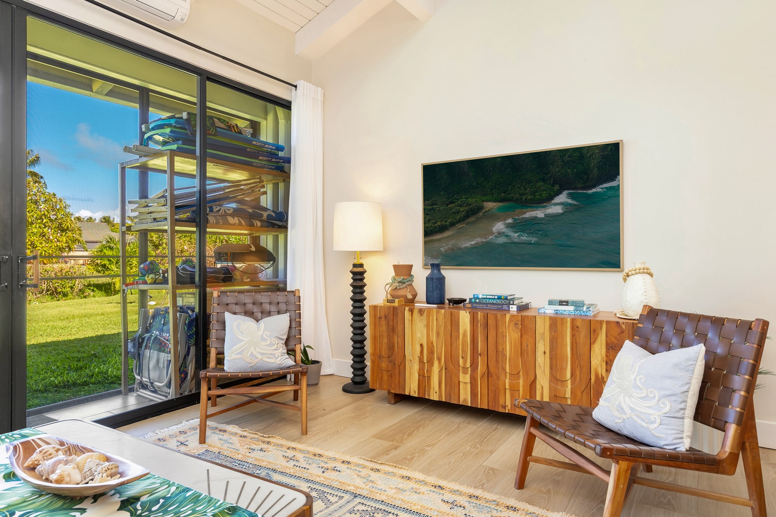 Open the sliding doors and let fresh air flow into this breezy, golf course-facing lounge. 