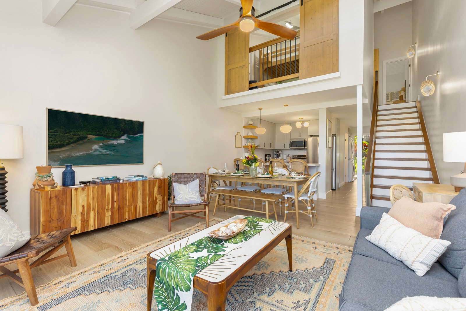 Your open-concept living room blends comfort and style with vaulted ceilings and indoor-outdoor flow.