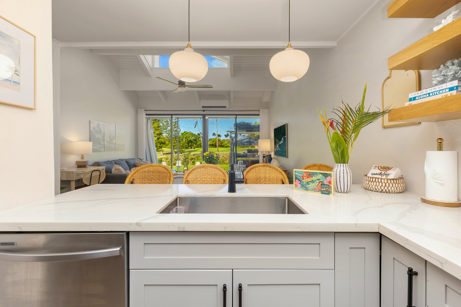 Whip up meals with ease in this stylish kitchen with plenty of prep space and open views to the living area. 