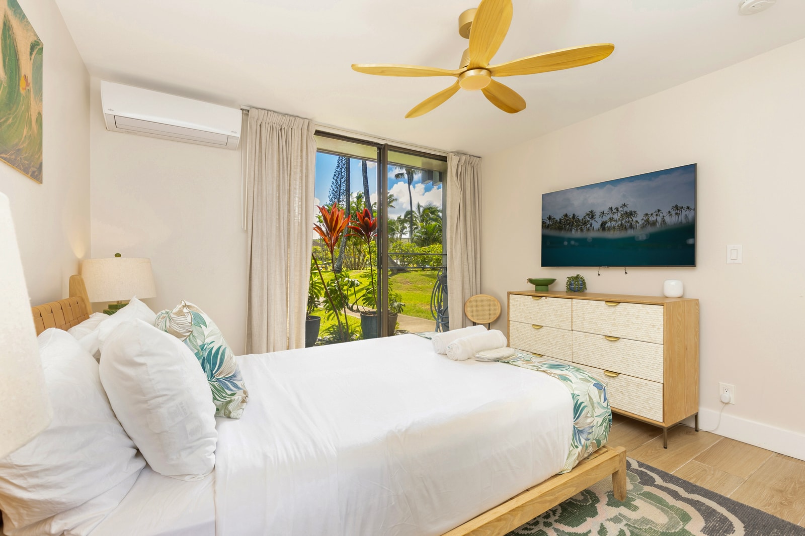 Rest easy in the main floor bedroom with private outdoor access and peaceful garden views.