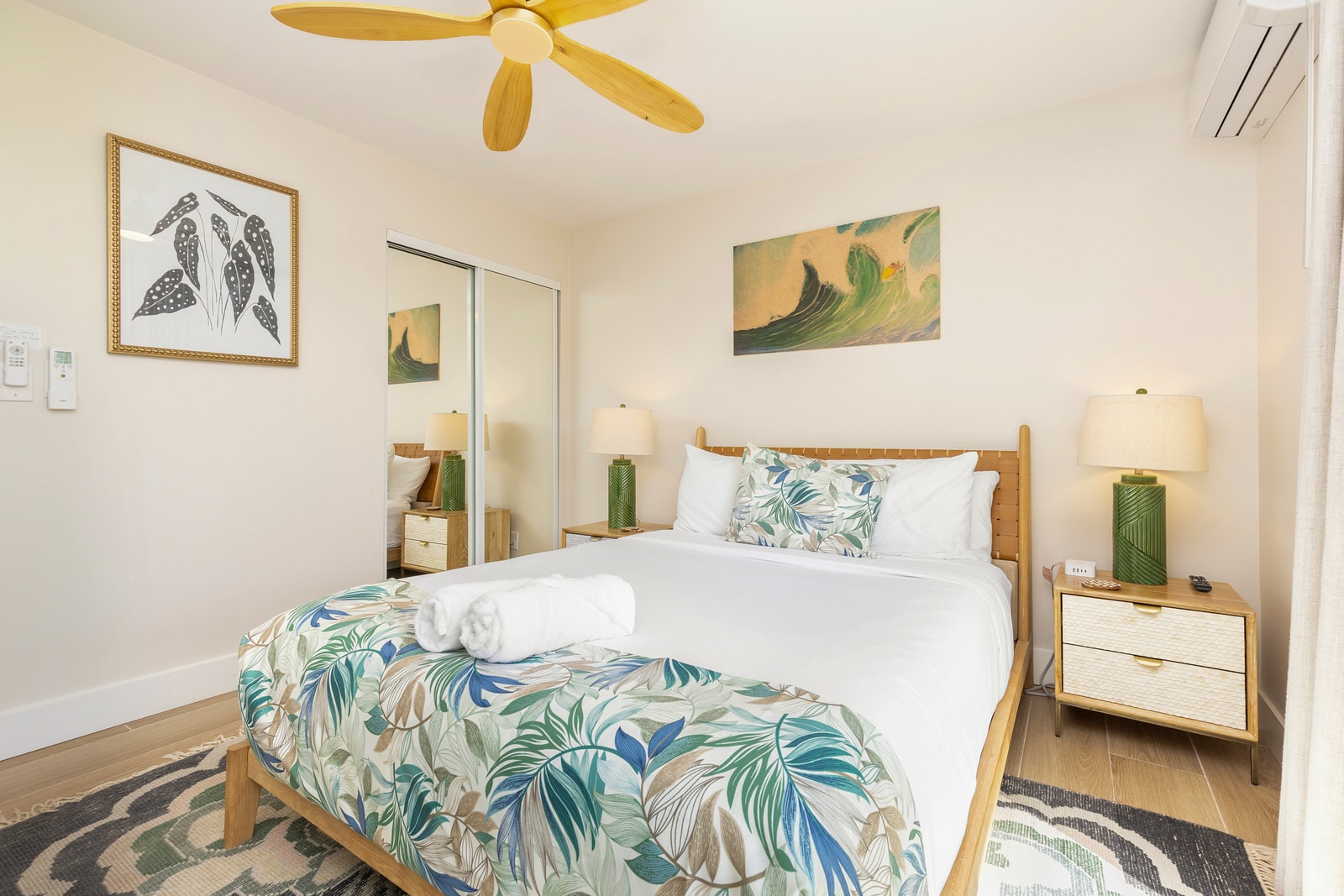 Soft lighting, tropical tones, and a Queen bed make this ground-floor bedroom the perfect retreat after exploring Oahu.