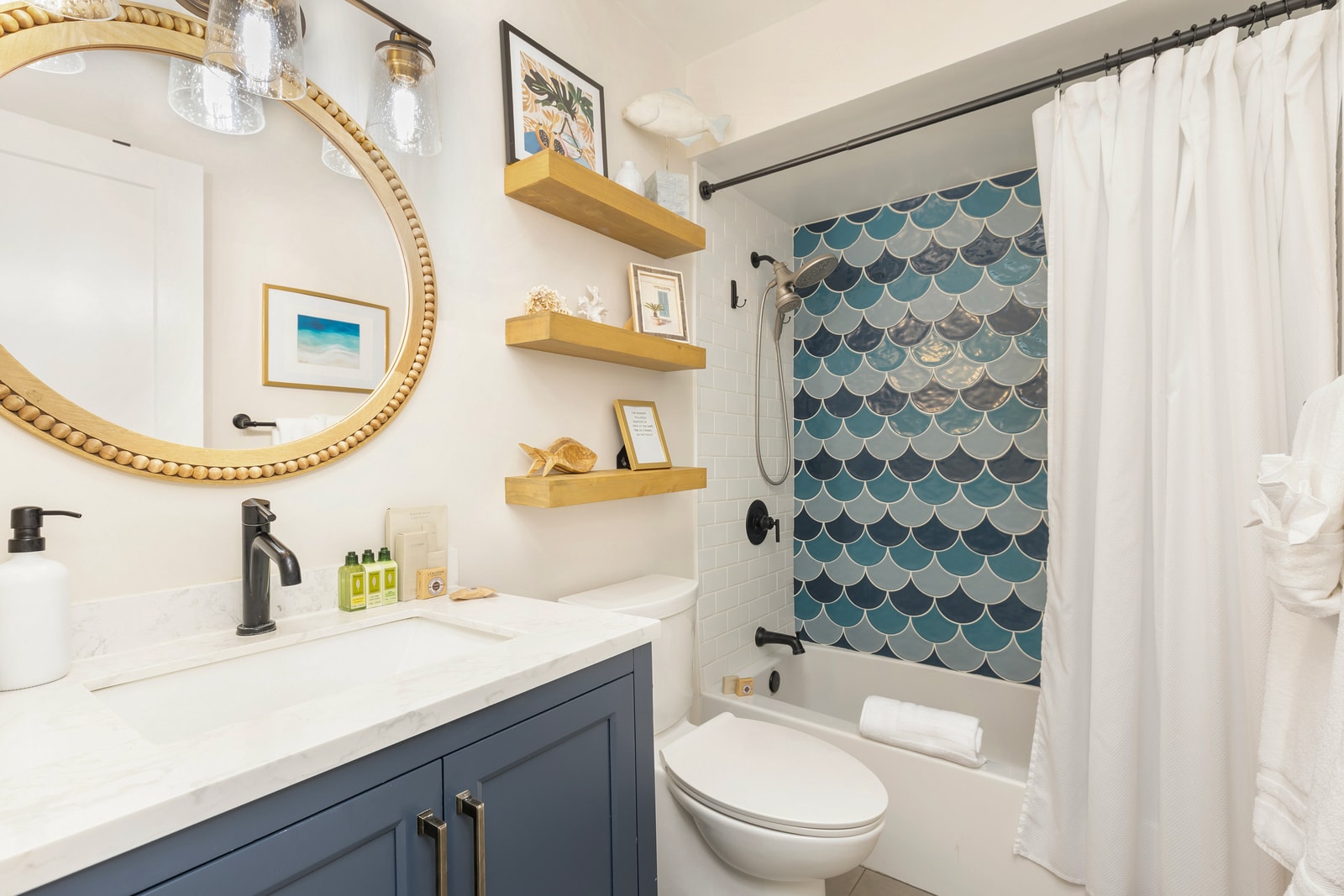 The shared bathroom on the main level includes a quartz vanity and full tub-shower combo, perfect for refreshing after beach time.