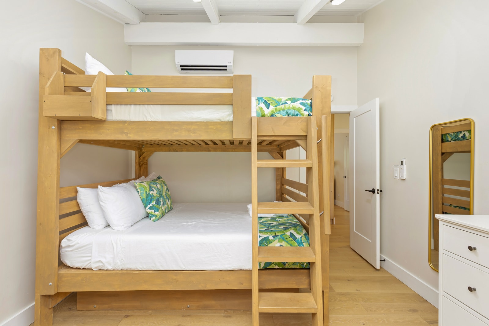 The third bedroom features Queen-over-Queen bunk beds plus a Full pull-out for flexible sleeping.