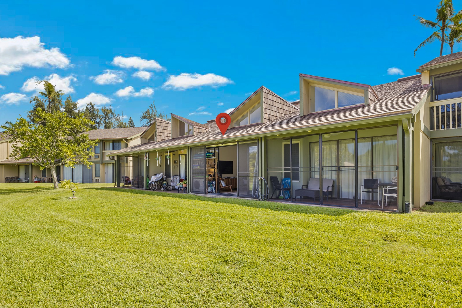 Your private lanai opens onto a spacious grassy lawn, perfect for a morning stroll or for kids to run and play.