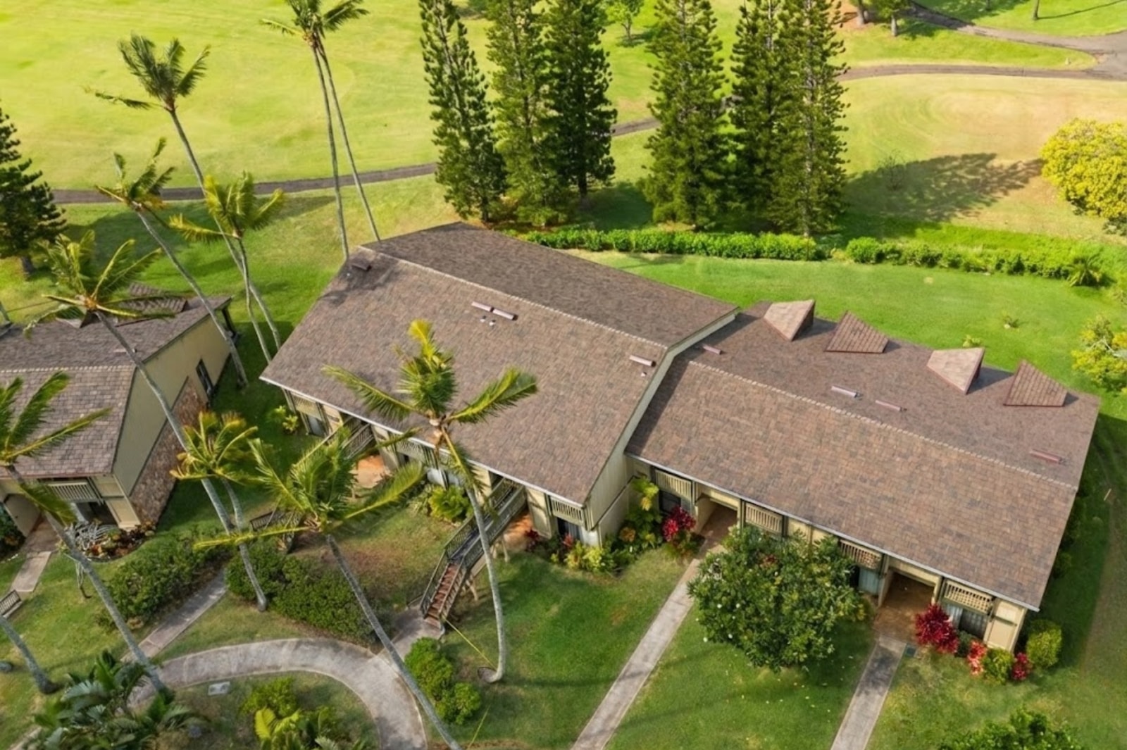 This gorgeous condo is surrounded by tropical foliage like palm trees and Ti plants.