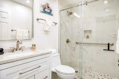 Wash away the salt and sand in your spa-like ensuite, featuring a walk-in shower and modern finishes. KUL-W145