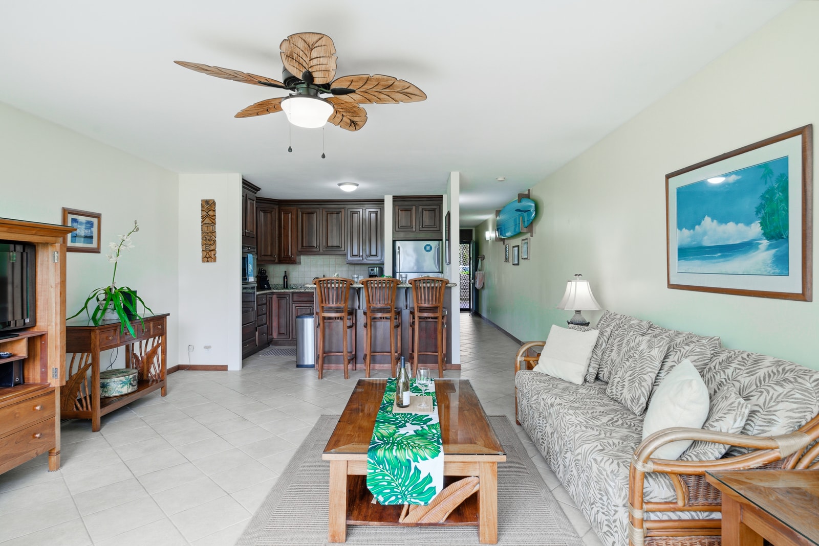 Full view of the open layout with a sleeper sofa and easy connection to the kitchen and dining.