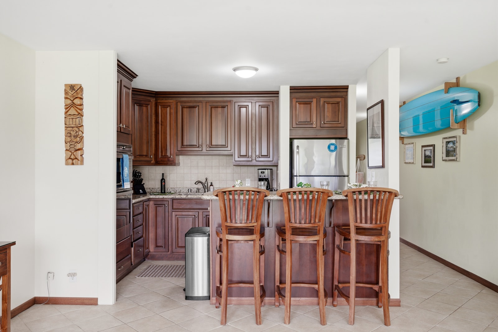 Bar seating and a fully equipped kitchen make at-home meals a breeze.