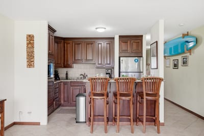 Bar seating and a fully equipped kitchen make at-home meals a breeze.
