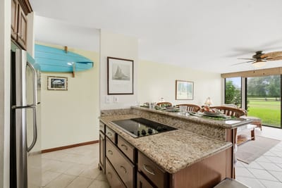 Enjoy island breezes as you prep meals in the spacious kitchen with views across the unit.