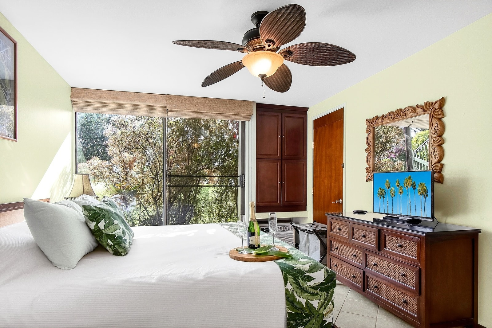 The bedroom offers plenty of natural light, a ceiling fan, and direct access to your ensuite bath