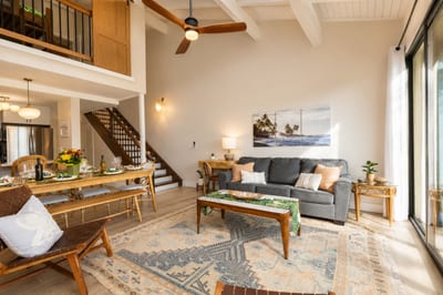 After a day in the sun, this relaxed space welcomes you home with volume ceilings and tropical textures.