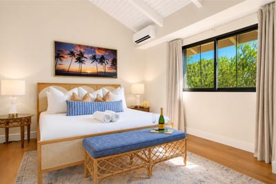The master bedroom upstairs features a King Size bed and AC unit to keep you cool, year-round.