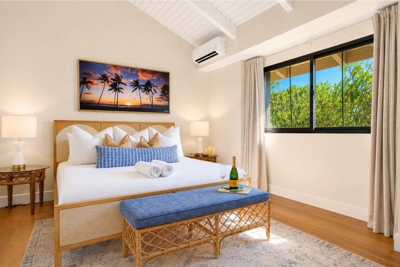 The master bedroom upstairs features a King Size bed and AC unit to keep you cool, year-round. KUL-W11