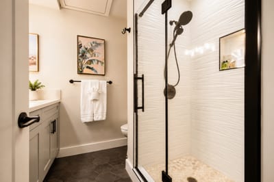 Your recently updated en-suite shower has a removable shower head with luxury shampoo, conditioner, and body soap included.