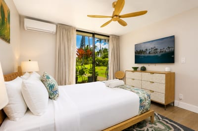 Rest easy in the main floor bedroom with private outdoor access and peaceful garden views.