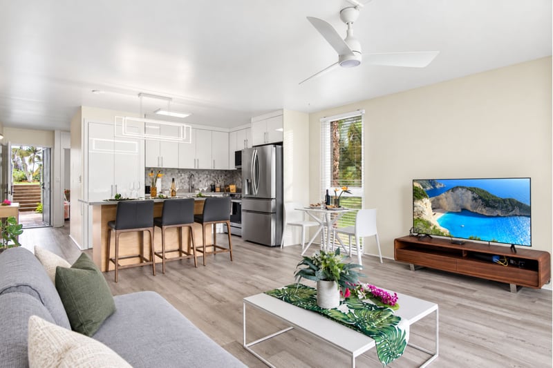 Open-concept living, dining, and kitchen at Kuilima West Estates 144, a bright, connected layout perfect for group stays.