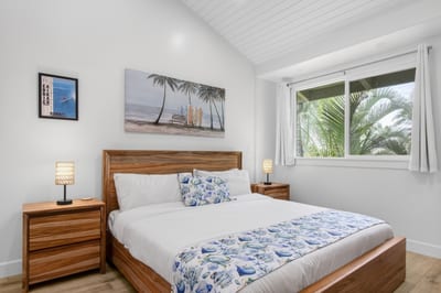 The primary bedroom features a plush king size bed and hotel grade linens for a resort like stay KUL-W145