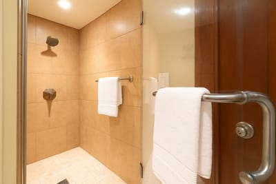 Enjoy the soothing rhythm of the rainfall shower and wrap yourself in luxury after a day of sun, surf, and serenity