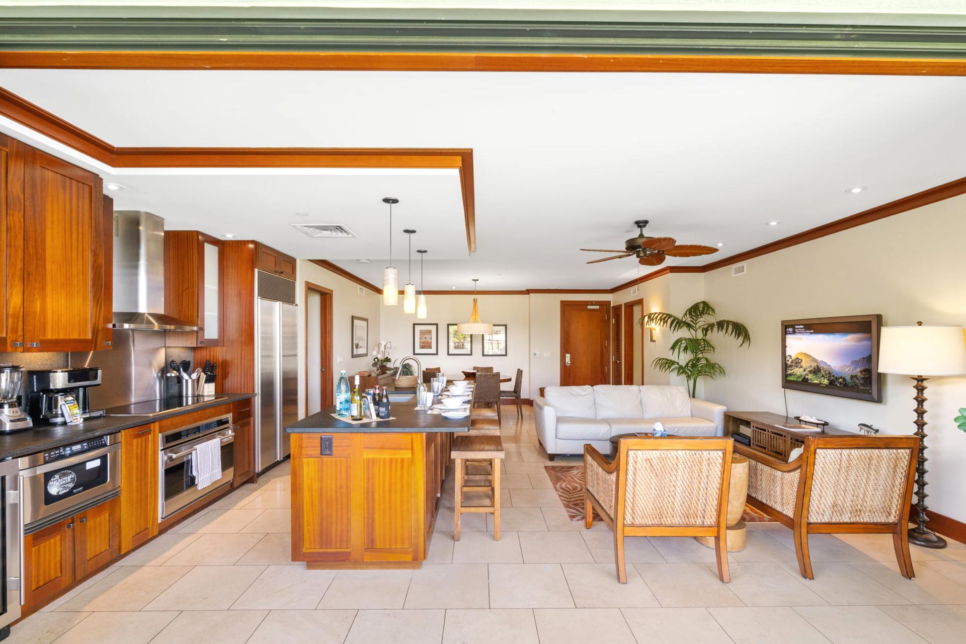 Wide-open floor plan connects the kitchen to living and outdoor spaces, creating the perfect gathering hub    