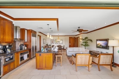 Wide-open floor plan connects the kitchen to living and outdoor spaces, creating the perfect gathering hub