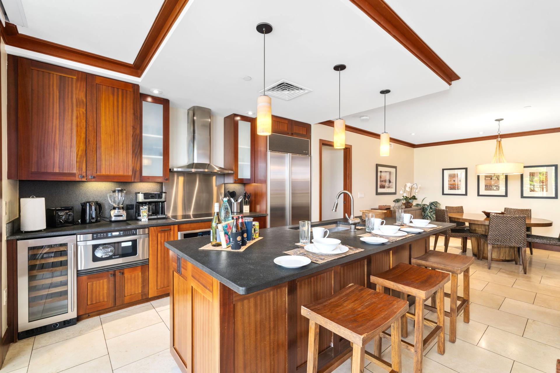 Warm wood tones meet modern luxury in this spacious kitchen—ideal for big breakfasts or sunset wine prep        
