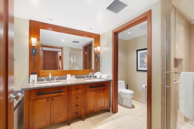 A peaceful master bath featuring polished fixtures and thoughtful touches for a little vacation pampering—every single day