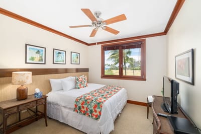 Fall asleep in a cozy Queen bed with hibiscus blooms at your side and palm trees waving hello just outside your window