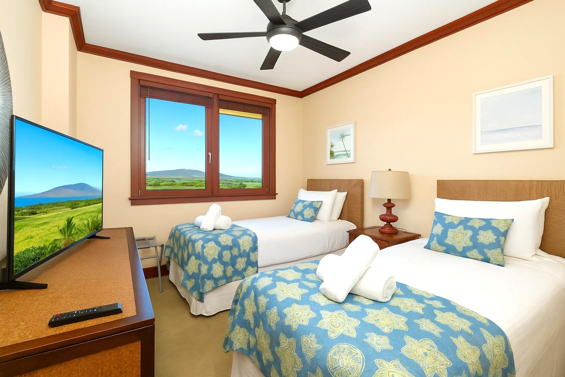 These twin-sized beds stand side by side like sandy sea turtles, wrapped in cheerful quilts and peaceful possibilities