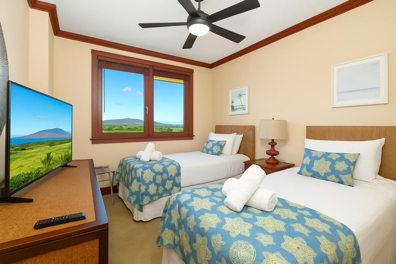 These twin-sized beds stand side by side like sandy sea turtles, wrapped in cheerful quilts and peaceful possibilities