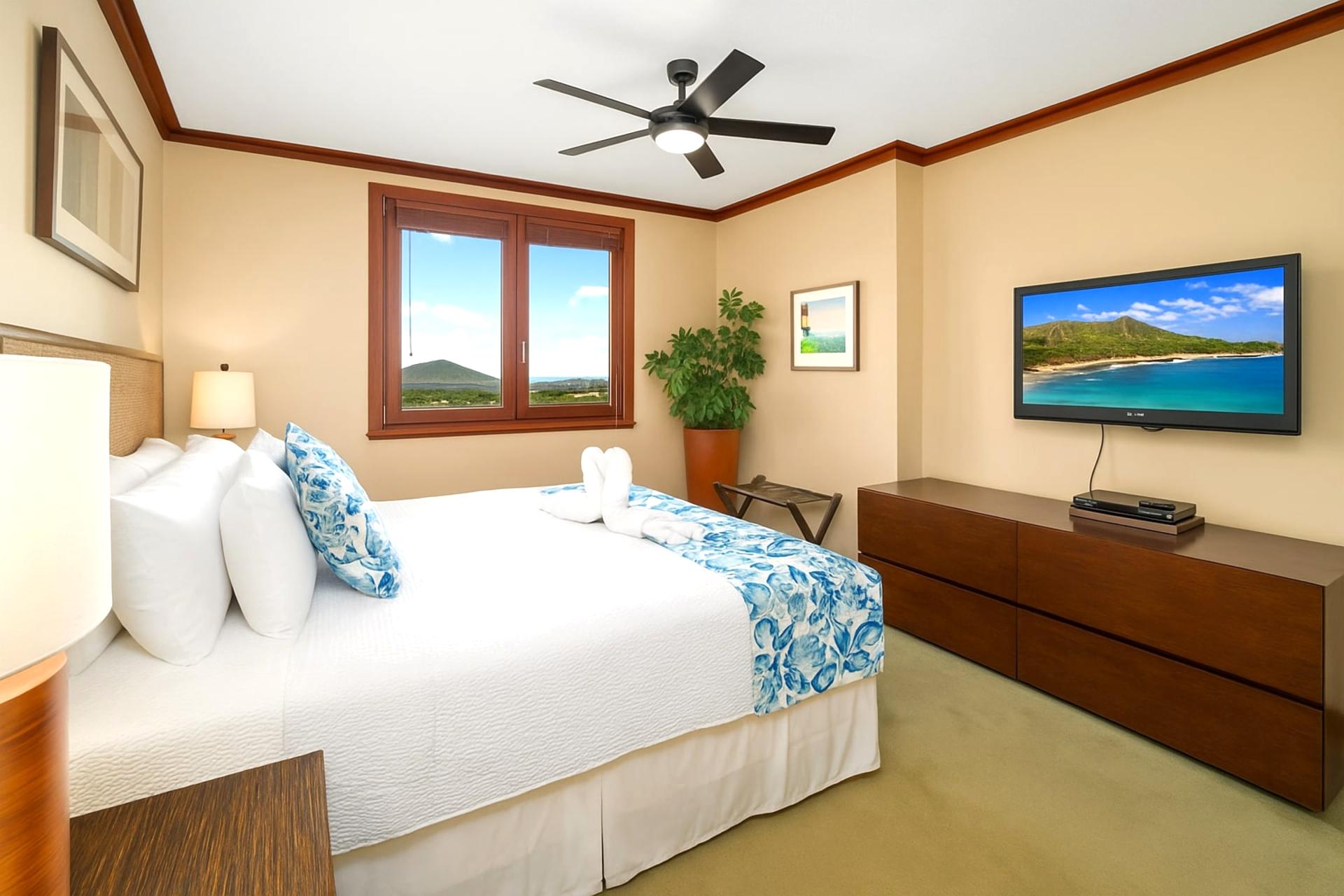 This king-sized bed is dressed in island florals and cloud-soft pillows, making it the crown jewel of nap kingdoms