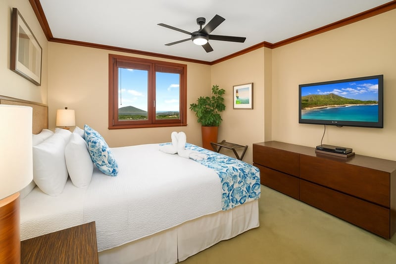 This king-sized bed is dressed in island florals and cloud-soft pillows, making it the crown jewel of nap kingdoms