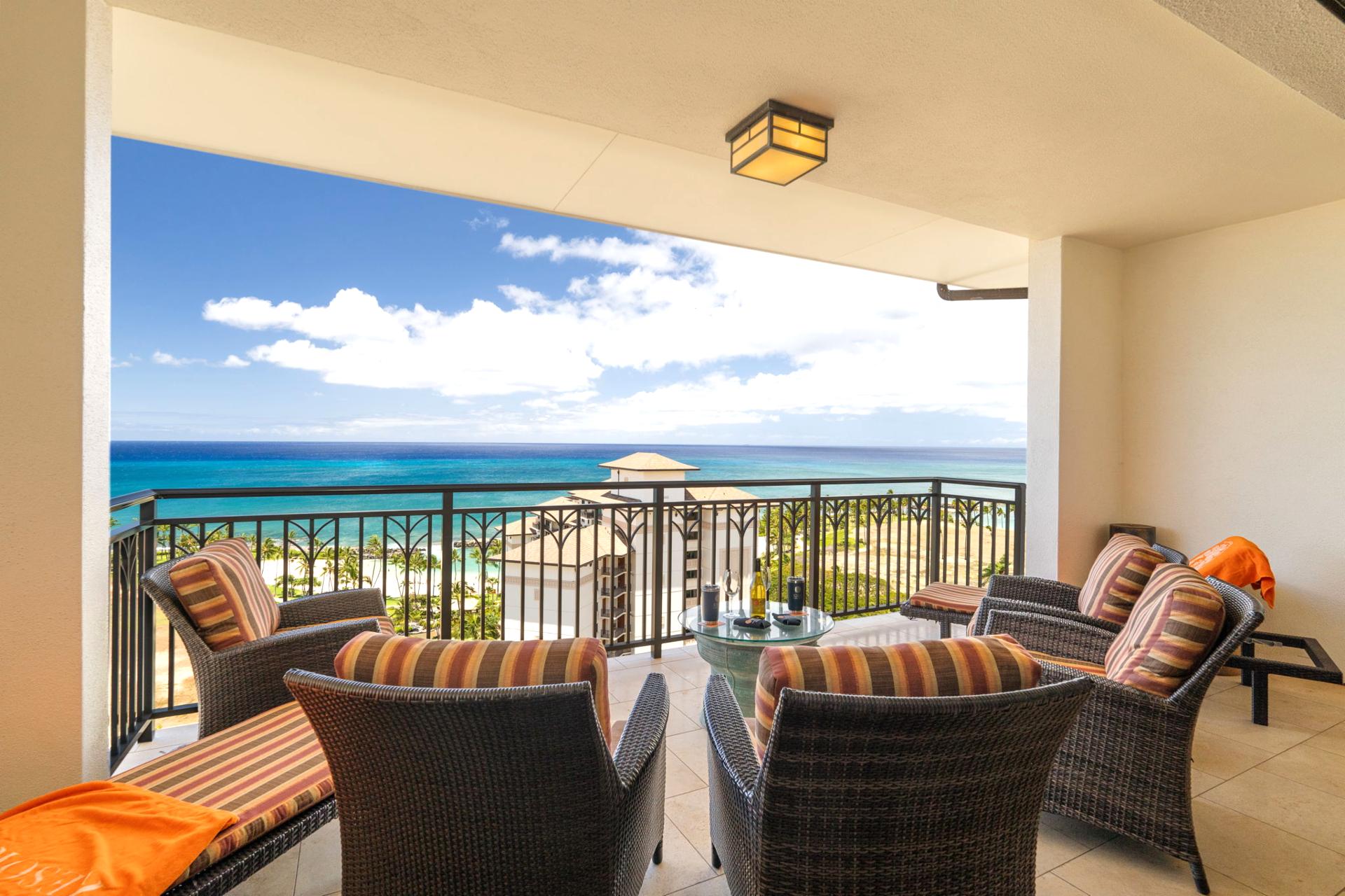 With stripe-clad chairs and ocean-stretched views, this lanai feels like a beach club in the sky—minus the crowds    
