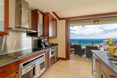 This kitchen glistens like a gourmet treasure chest, with stainless steel shining brighter than a polished pearl