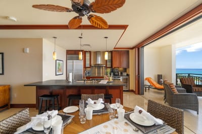 With ceiling fans shaped like palm leaves and napkins folded like origami dreams, this space is a tropical waltz