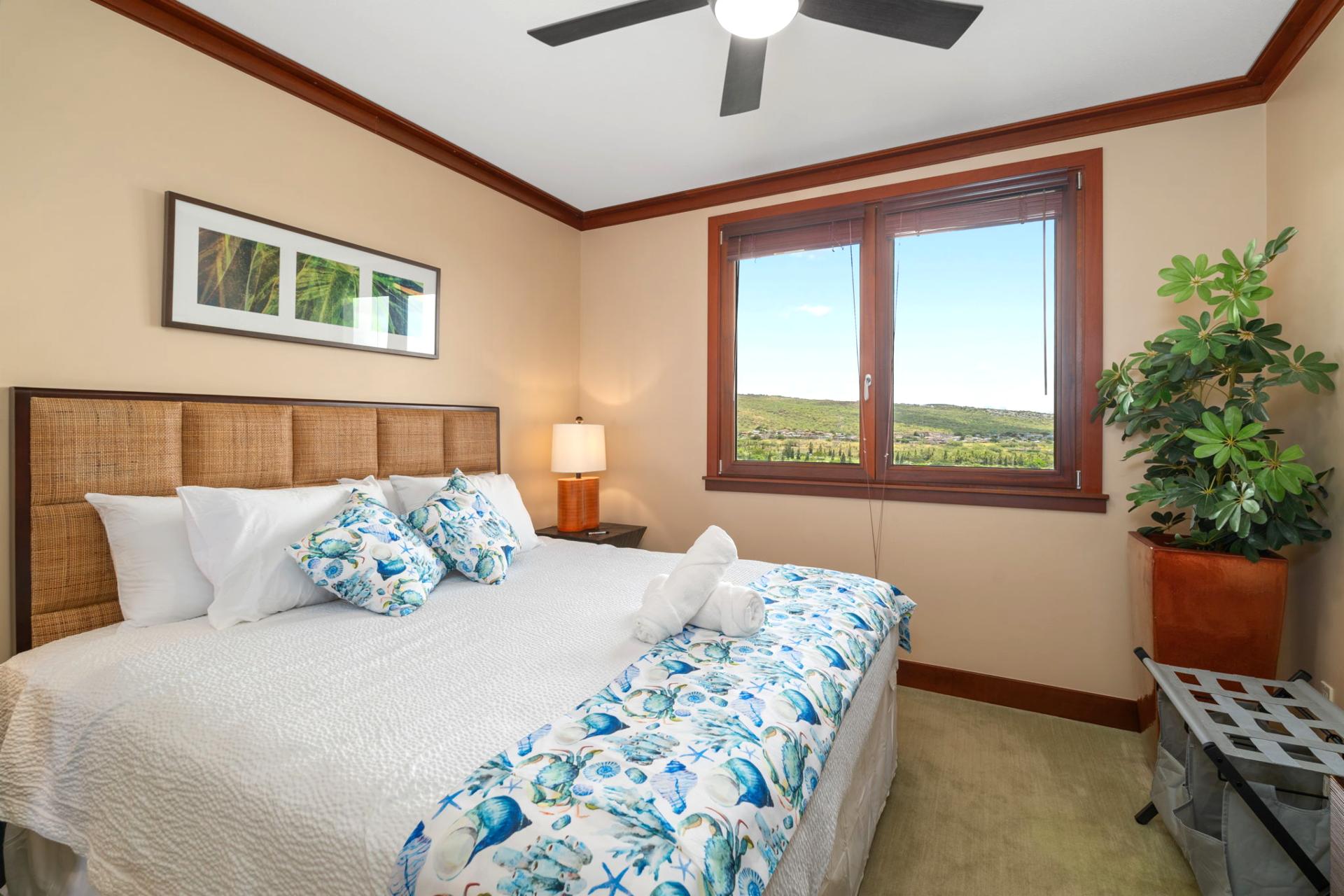  Wrapped in tropical blues and crisp white linens, this king bed invites you to sink, sprawl, and forget your shoes    