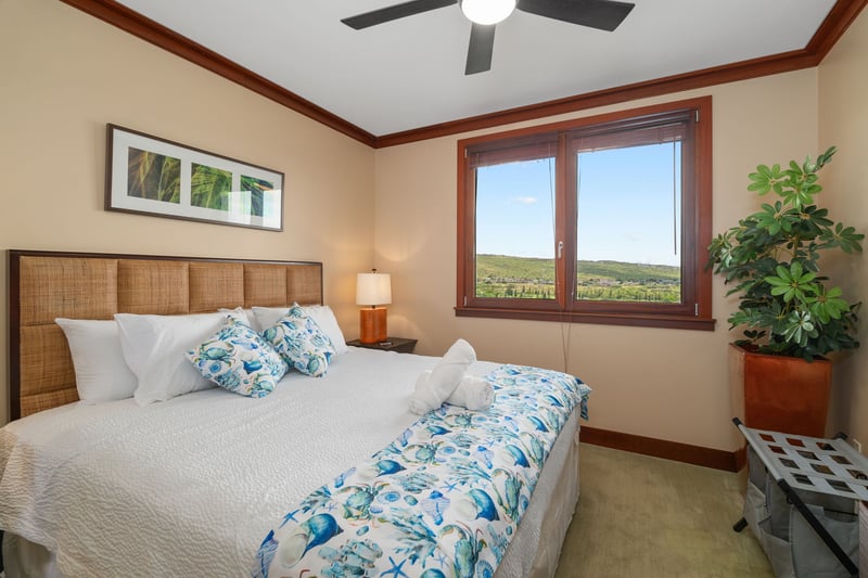  Wrapped in tropical blues and crisp white linens, this king bed invites you to sink, sprawl, and forget your shoes    